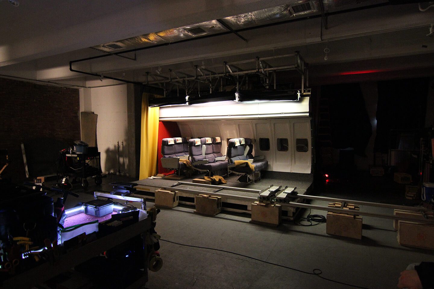 A stage with lights and boxes in the middle of it.
