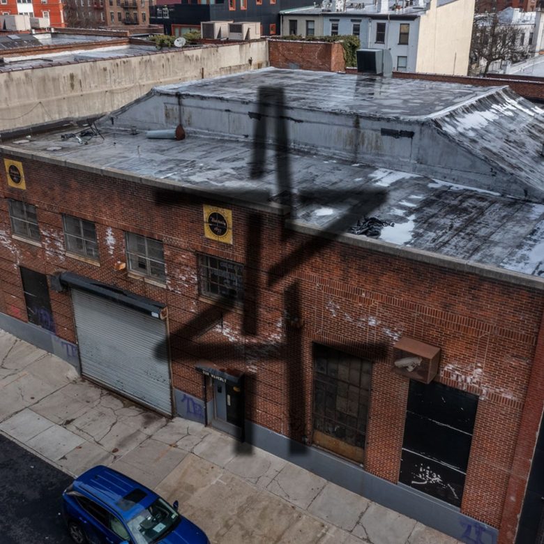 A building with four crosses on it's roof.