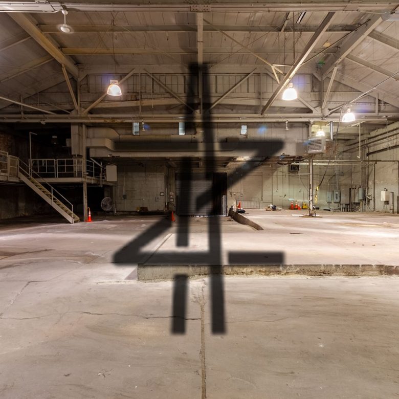 A large warehouse with four numbers painted on it.