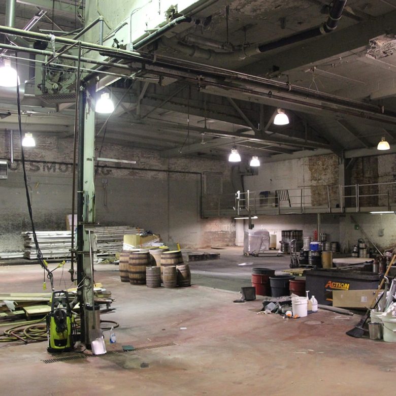 A large warehouse with many lights and equipment.
